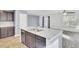 Contemporary kitchen island with a stainless steel sink, dishwasher, and dark cabinetry offering functional space at 116 Bright Meadow Rd, Summerville, SC 29483