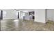 Expansive living space with ample windows and sleek flooring, creating a bright and inviting atmosphere at 116 Bright Meadow Rd, Summerville, SC 29483