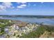 Picturesque aerial view of coastal homes near a calm bay and private boat docks at 1207 Rivers Reach Dr, Wando, SC 29492