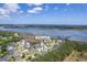 Gorgeous aerial view of the property at 1207 Rivers Reach Dr surrounded by waterfront and gorgeous trees at 1207 Rivers Reach Dr, Wando, SC 29492