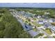 Community aerial view featuring picturesque homes, a scenic pond, and lush landscaping at 1207 Rivers Reach Dr, Wando, SC 29492