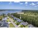 Aerial view of home at 1207 Rivers Reach Dr, nestled near the water and lush greenery at 1207 Rivers Reach Dr, Wando, SC 29492
