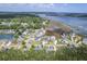 Expansive aerial view showcasing the waterfront community and surrounding lush landscapes at 1207 Rivers Reach Dr, Wando, SC 29492