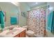 Bright bathroom featuring a seashell-themed shower curtain and colorful decor at 1207 Rivers Reach Dr, Wando, SC 29492