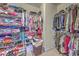 Spacious walk-in closet offers ample storage with racks and shelving for clothes and shoes at 1207 Rivers Reach Dr, Wando, SC 29492