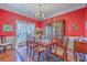 Dining room showcasing a wood table, china cabinet, chandelier, and beautiful hardwood flooring at 1207 Rivers Reach Dr, Wando, SC 29492