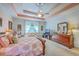 Comfortable main bedroom with natural light, a ceiling fan, and a dresser at 1207 Rivers Reach Dr, Wando, SC 29492