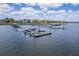 An aerial view of a full marina, showing multiple boats docked on a sunny day with a clear blue sky at 1207 Rivers Reach Dr, Wando, SC 29492