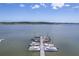 An aerial view of a full marina with multiple boats docked in the water on a sunny day with a clear blue sky at 1207 Rivers Reach Dr, Wando, SC 29492