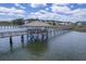 Waterfront gazebo on a long pier with beautiful blue water and residential homes in the background at 1207 Rivers Reach Dr, Wando, SC 29492