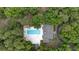 Secluded backyard with in-ground pool, patio, and lush landscaping for relaxing outdoor living at 122 Hidden Fawn Cir, Goose Creek, SC 29445