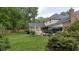 Backyard with new fence, a deck, screened porch and lush green grass at 122 Hidden Fawn Cir, Goose Creek, SC 29445