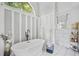 Stylish bathroom featuring a luxurious soaking tub, modern fixtures, and elegant white and grey decor at 122 Hidden Fawn Cir, Goose Creek, SC 29445