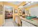Bright bathroom vanity featuring a vessel sink, granite counters, and decorative lighting near the bedroom at 122 Hidden Fawn Cir, Goose Creek, SC 29445