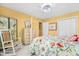 Bedroom featuring floral bedding, rocking chair, and white closet doors at 122 Hidden Fawn Cir, Goose Creek, SC 29445