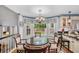 Cozy breakfast nook with chandelier, window views and hardwood floors at 122 Hidden Fawn Cir, Goose Creek, SC 29445
