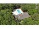 Aerial view of a large community pool surrounded by a wooded area at 122 Hidden Fawn Cir, Goose Creek, SC 29445