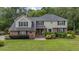 Charming two-story home with brick and siding exterior, lush landscaping, and a well-maintained lawn at 122 Hidden Fawn Cir, Goose Creek, SC 29445