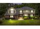 Charming two-story home with brick and siding exterior, lush landscaping, and a well-maintained lawn at dusk at 122 Hidden Fawn Cir, Goose Creek, SC 29445