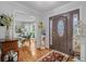 Elegant foyer with hardwood floors, decorative rug, and stained glass door, offering a grand entrance at 122 Hidden Fawn Cir, Goose Creek, SC 29445