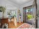 Elegant foyer with hardwood floors, decorative rug, and stained glass door, offering a grand entrance at 122 Hidden Fawn Cir, Goose Creek, SC 29445