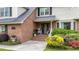 Inviting entrance featuring a brick pathway, and lush landscaping at 122 Hidden Fawn Cir, Goose Creek, SC 29445
