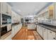 Spacious kitchen with white cabinets, granite counters, stainless appliances, and hardwood floors at 122 Hidden Fawn Cir, Goose Creek, SC 29445