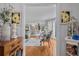 Cozy living room with hardwood floors, neutral decor, and open doorway to the dining area at 122 Hidden Fawn Cir, Goose Creek, SC 29445