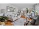 Comfortable living room featuring a plush sofa, stylish decor, and a seamless transition to the dining area at 122 Hidden Fawn Cir, Goose Creek, SC 29445