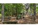 Wooded community playground area with many different stations for children to explore at 122 Hidden Fawn Cir, Goose Creek, SC 29445
