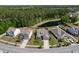 Homes near pond and trees in a suburban neighborhood with paved road at 1245 Hammrick Ln, Johns Island, SC 29455