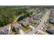View of homes and a pond in a community with mature trees and a paved road at 1245 Hammrick Ln, Johns Island, SC 29455