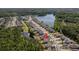 Overhead picture of neighborhood featuring lake, mature trees and a clear pin drop location at 1245 Hammrick Ln, Johns Island, SC 29455