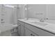 A bathroom featuring a double vanity, quartz countertops, and a shower-tub combo at 1245 Hammrick Ln, Johns Island, SC 29455