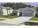 A cozy single-Gathering home is nestled within a peaceful neighborhood with mature trees and beautiful landscaping at 1245 Hammrick Ln, Johns Island, SC 29455