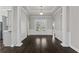 Elegant foyer with hardwood floors, decorative columns, wainscoting, and a front door with glass inserts at 1245 Hammrick Ln, Johns Island, SC 29455