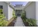 Inviting front entrance with lush landscaping and a pathway leading to the double-door entry at 1245 Hammrick Ln, Johns Island, SC 29455