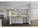Kitchen island with granite countertop, stainless steel dishwasher, and eat in bar at 1245 Hammrick Ln, Johns Island, SC 29455