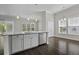 Kitchen island with granite countertops, stainless steel dishwasher, and natural lighting at 1245 Hammrick Ln, Johns Island, SC 29455