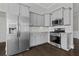Modern kitchen features stainless steel appliances, gray cabinets, and subway tile backsplash at 1245 Hammrick Ln, Johns Island, SC 29455