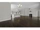 Inviting living room featuring a kitchen island, stainless steel appliances, fireplace, and hardwood floors at 1245 Hammrick Ln, Johns Island, SC 29455