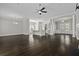 Spacious living area with hardwood floors, ceiling fan, kitchen island, and fireplace at 1245 Hammrick Ln, Johns Island, SC 29455
