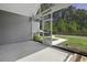 Screened-in patio features a hot tub and views of the spacious backyard and wooded area at 1245 Hammrick Ln, Johns Island, SC 29455