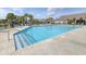 Community swimming pool with lounge chairs for relaxing by the clear blue water at 1245 Hammrick Ln, Johns Island, SC 29455