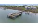 Aerial view of waterfront homes with boat docks and boat lifts, nestled along the scenic waterway at 126 W 2Nd St, Folly Beach, SC 29439