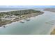 Breathtaking aerial view of coastal homes, beaches, and waterways, showcasing the stunning natural beauty and luxurious living at 126 W 2Nd St, Folly Beach, SC 29439
