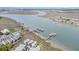 Extensive aerial view of a coastal community with waterfront homes, docks, and marshlands, highlighting the serene setting at 126 W 2Nd St, Folly Beach, SC 29439