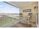 Inviting balcony with comfortable seating, offering picturesque waterfront views and a relaxing outdoor space at 126 W 2Nd St, Folly Beach, SC 29439