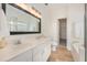 Bright bathroom with double vanity, ample counter space, and a separate tub and shower at 126 W 2Nd St, Folly Beach, SC 29439