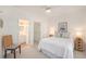 Inviting bedroom showcasing a view of the ensuite bathroom, creating a peaceful and private retreat at 126 W 2Nd St, Folly Beach, SC 29439